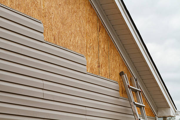 Professional Siding Installation technician working in McClellandtown, PA